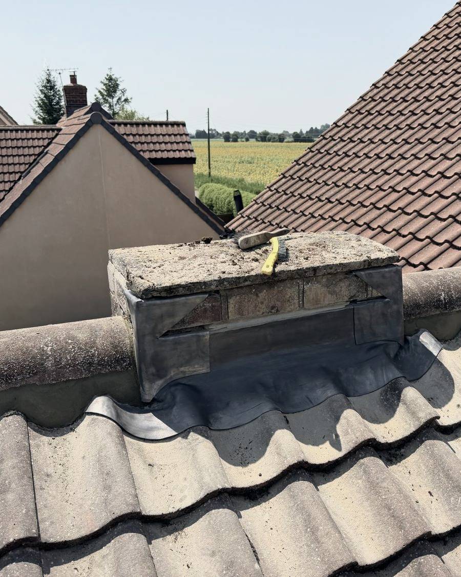 After: new lead flashing dressed around the chimney
