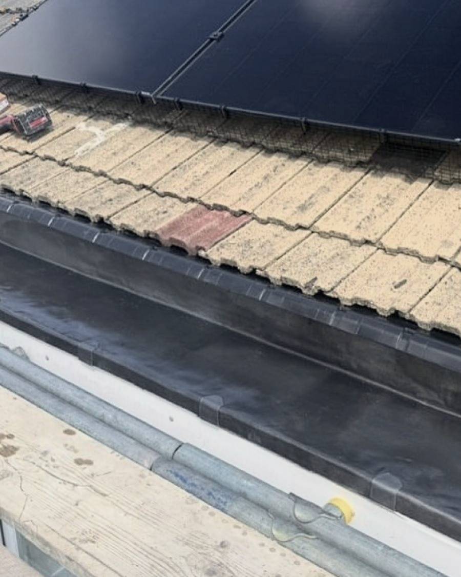After: box gutter relined with a new rubber membrane and edge trims