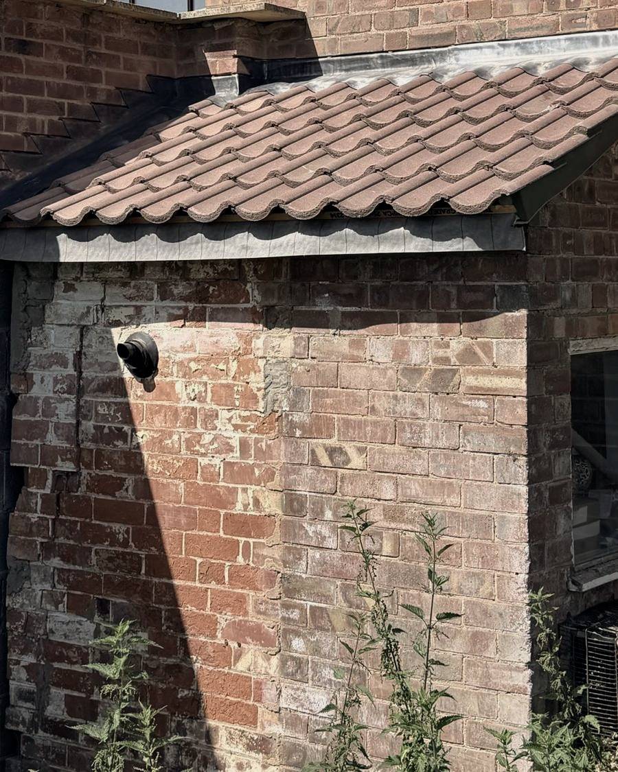 After: lean-to re-tiled with lead flashings to the walls